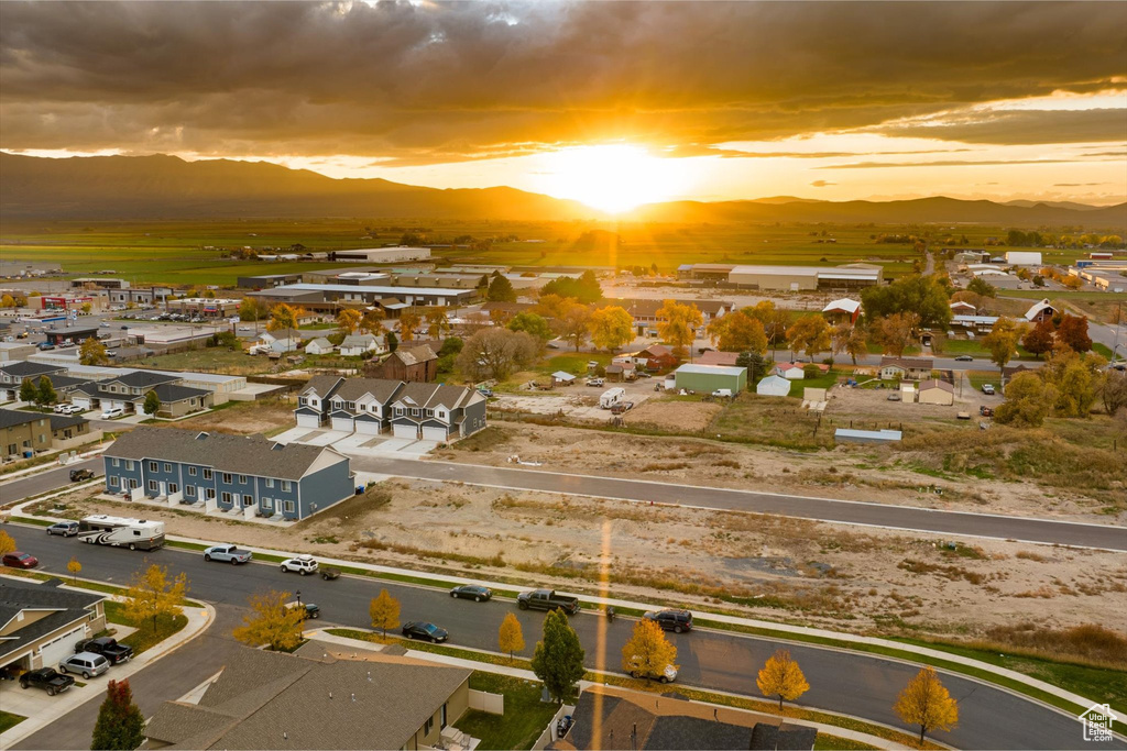 Aerial view at dusk featuring a mountain view