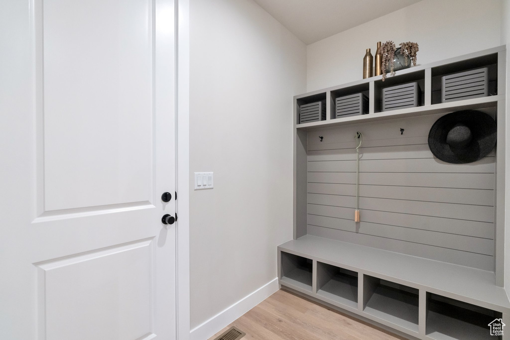 Mudroom with light wood-type flooring