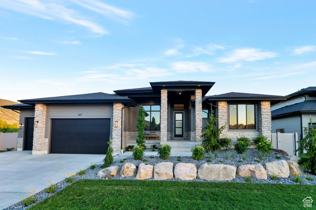 Prairie-style house featuring a garage