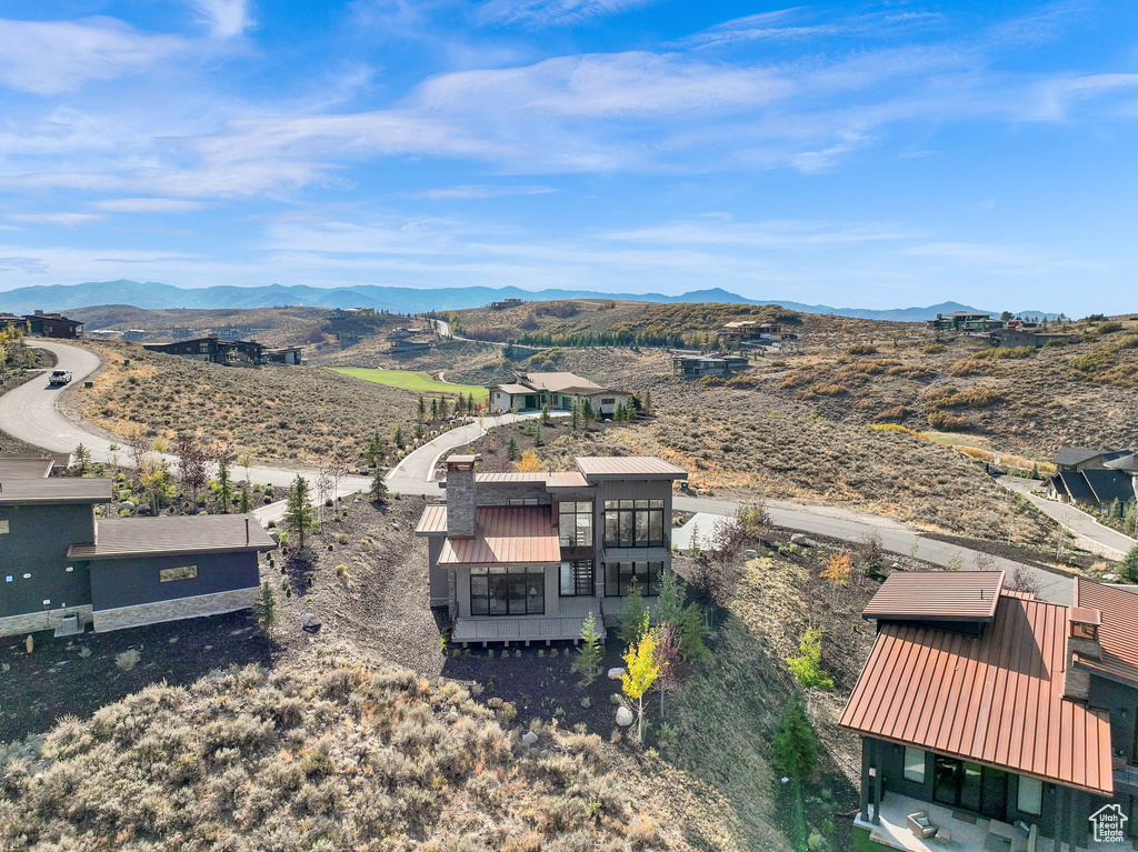 Birds eye view of property with a mountain view