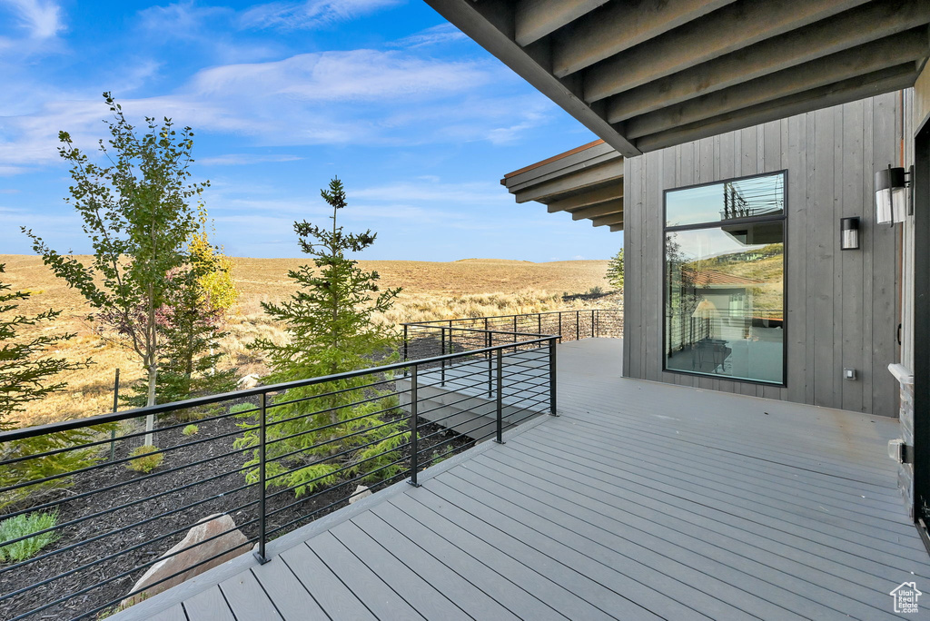 Wooden deck featuring a rural view