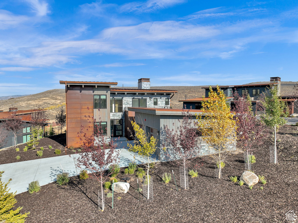 View of front of property with a mountain view