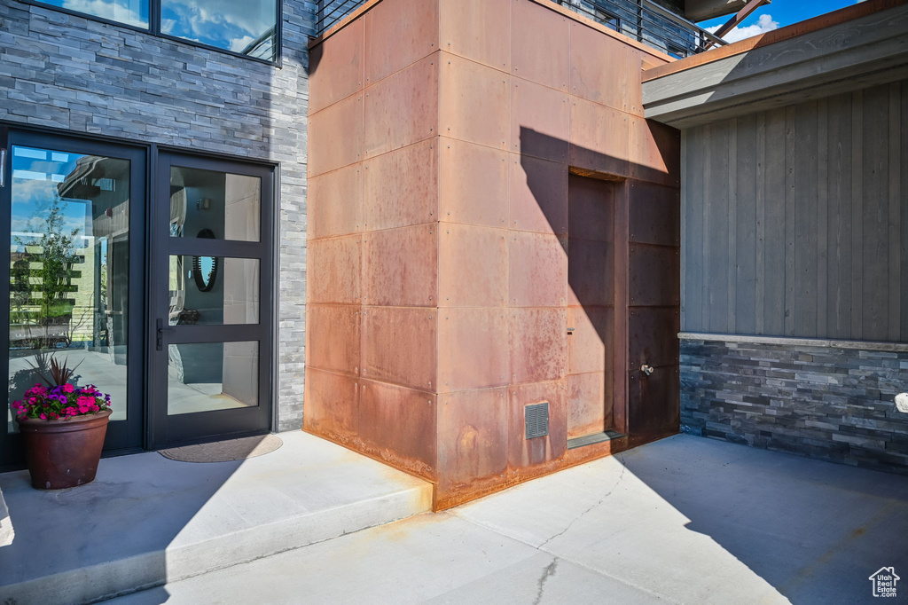 Property entrance featuring a patio and french doors