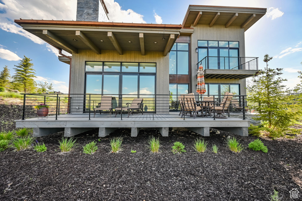 Back of property featuring a balcony