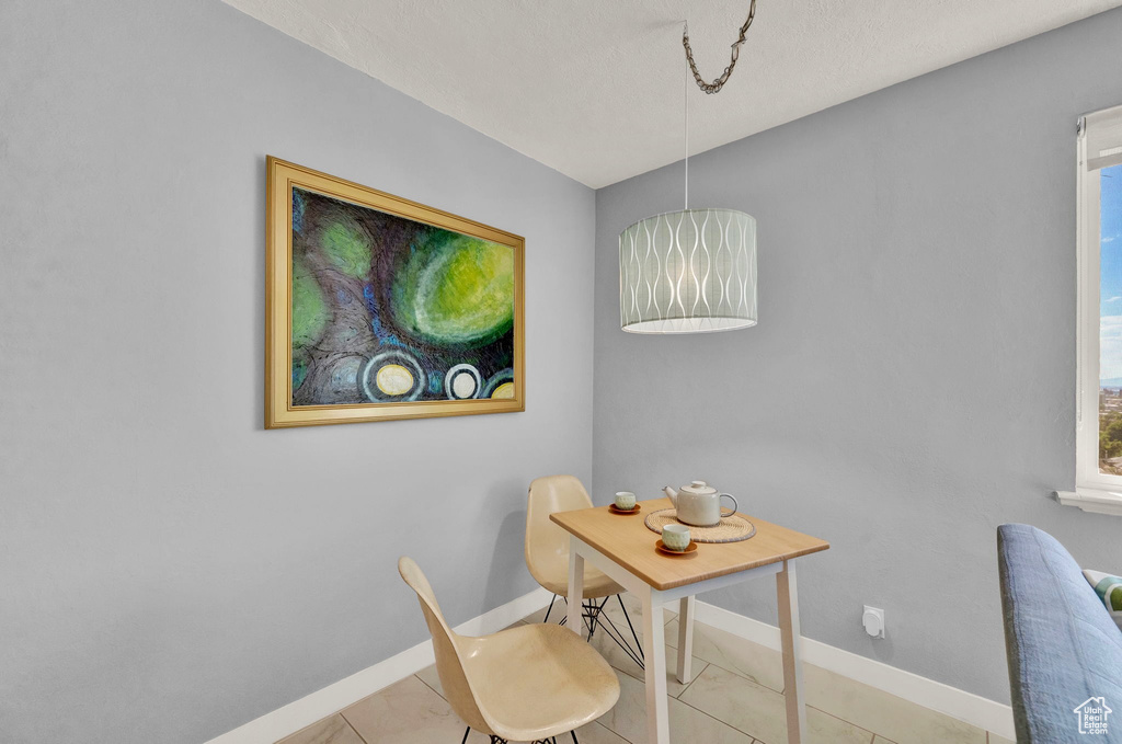 Dining room with tile patterned flooring