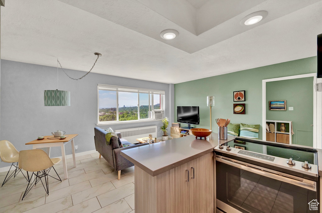 Interior space with light tile patterned flooring and stove