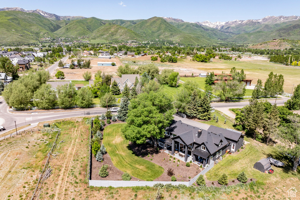 Birds eye view of property with a mountain view