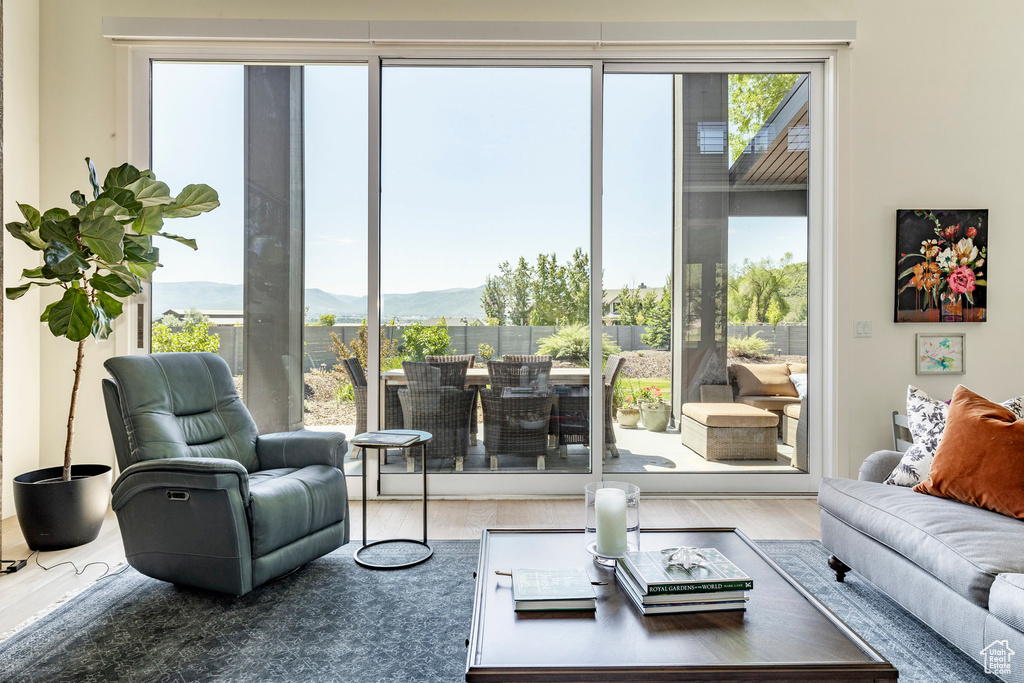 Living room with a mountain view and hardwood / wood-style floors