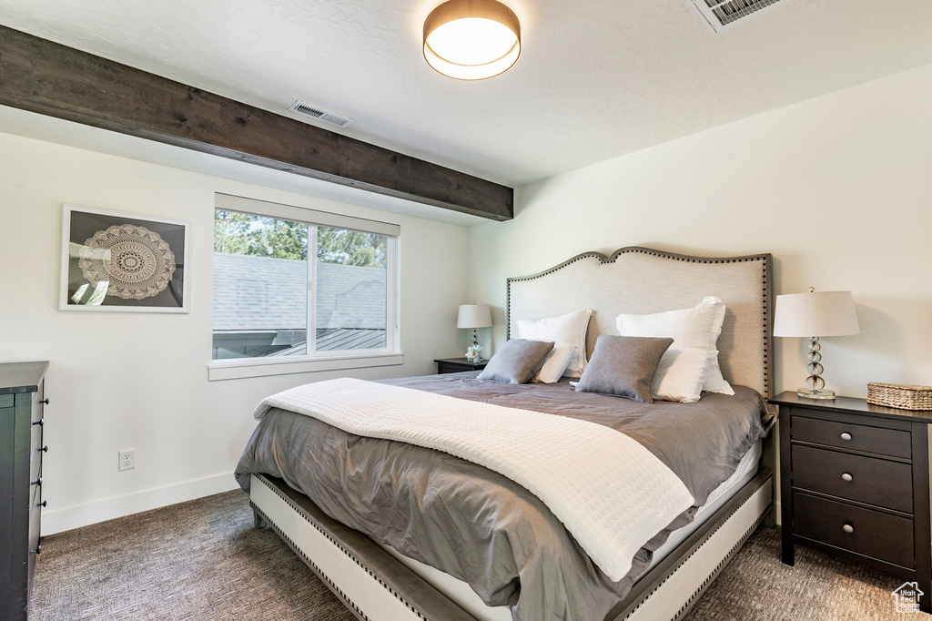 Bedroom with dark carpet