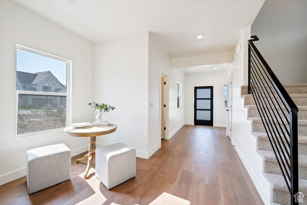 Foyer entrance with hardwood / wood-style flooring