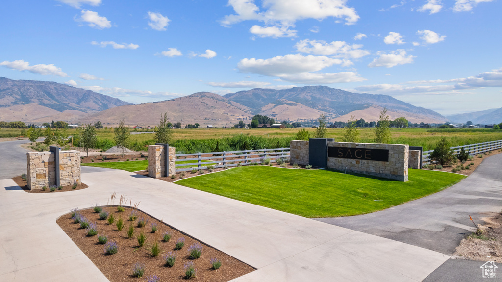 Property view of mountains with a rural view