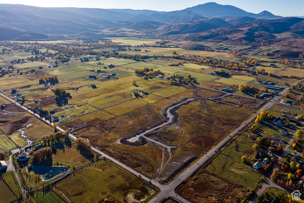 Aerial view featuring a rural view and a mountain view