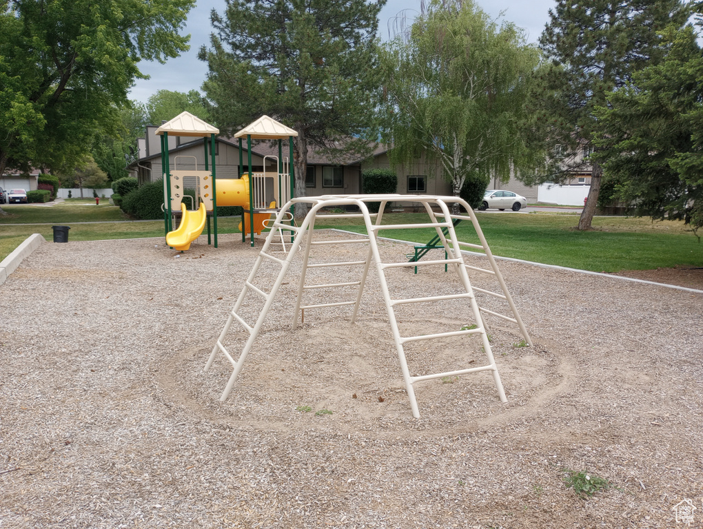 Exterior space featuring a playground and a yard