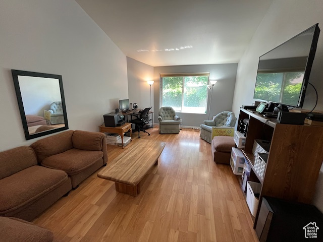 Living room with light hardwood / wood-style floors