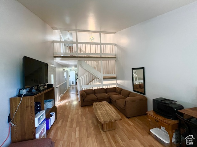 Living room with light hardwood / wood-style floors