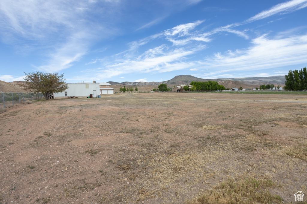 View of yard featuring a mountain view and a rural view