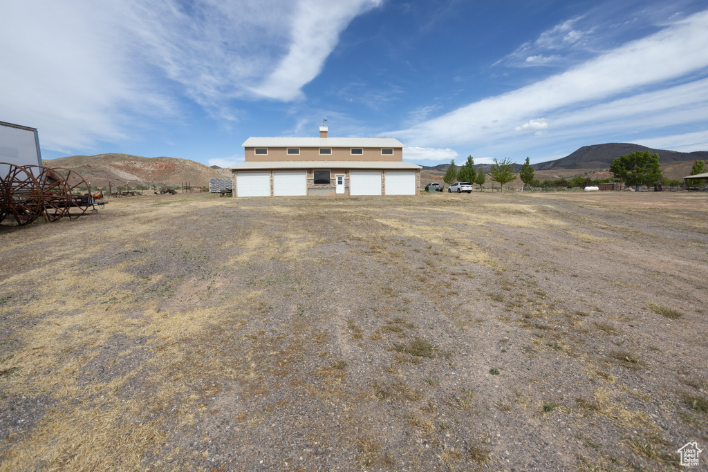 Exterior space featuring a garage and a mountain view