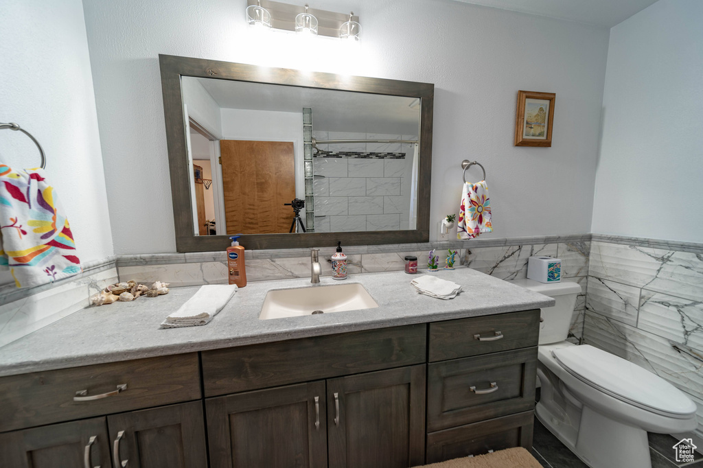 Bathroom with toilet and large vanity