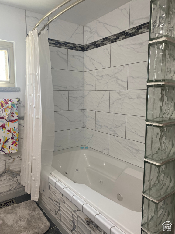 Bathroom with shower / tub combo with curtain