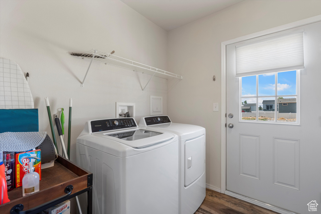 Laundry room with hardwood / wood-style floors, washer hookup, and independent washer and dryer