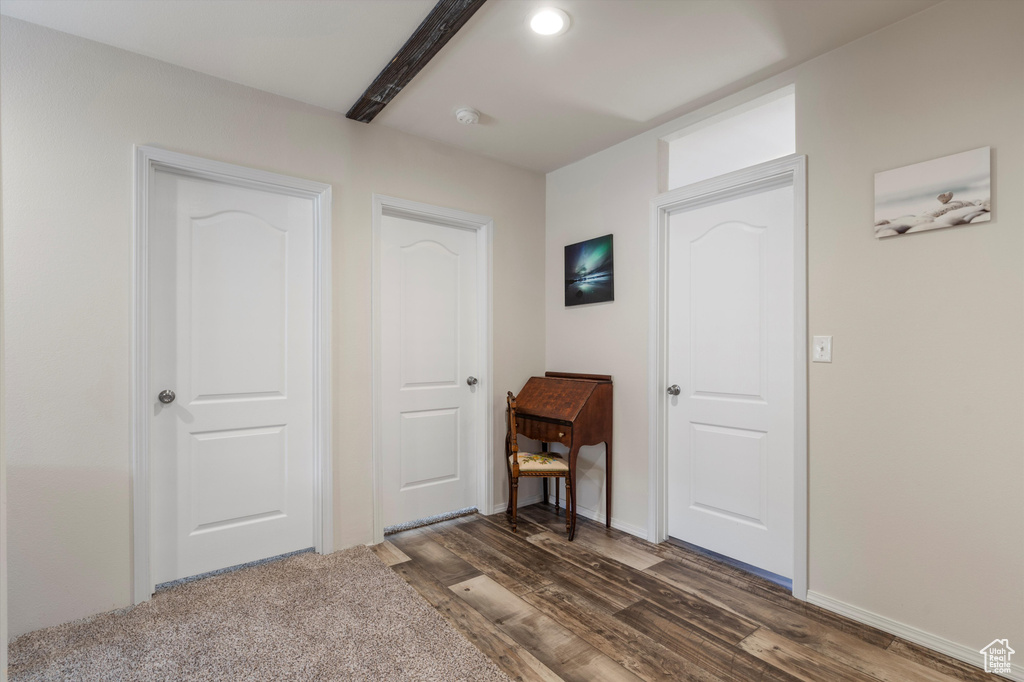 Bedroom featuring dark carpet