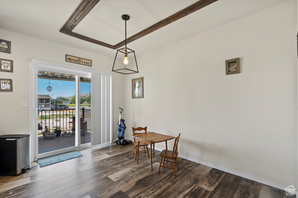 Dining room with dark wood-type flooring