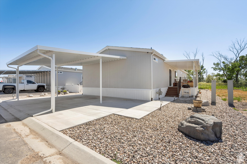 View of front of property with a carport