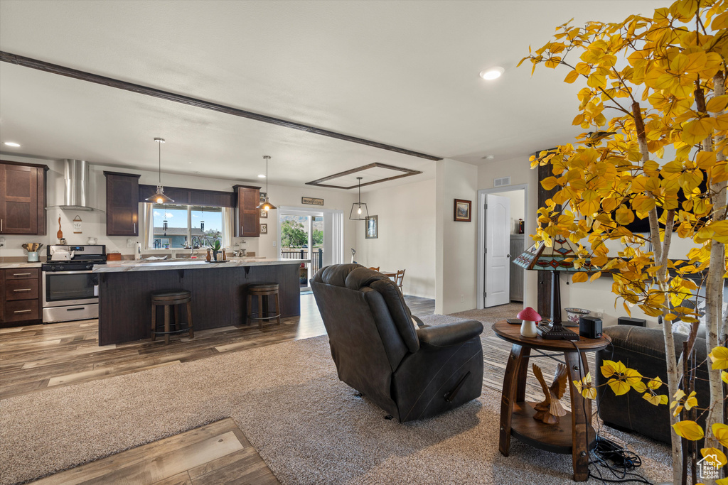 Living room with hardwood / wood-style flooring