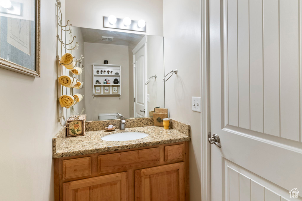 Bathroom with toilet and vanity