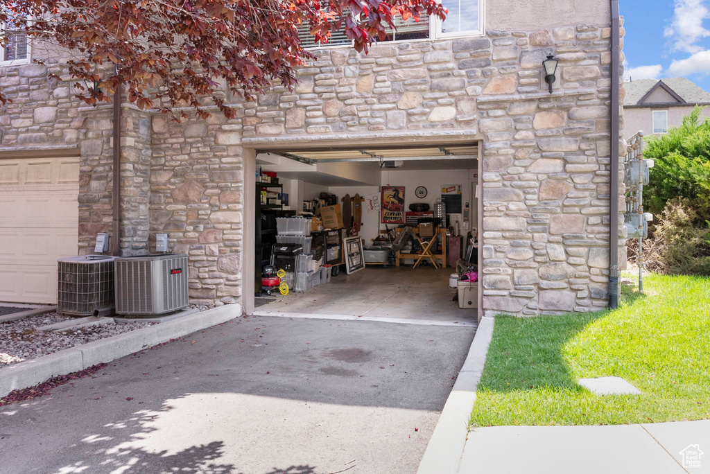 Garage featuring central AC unit