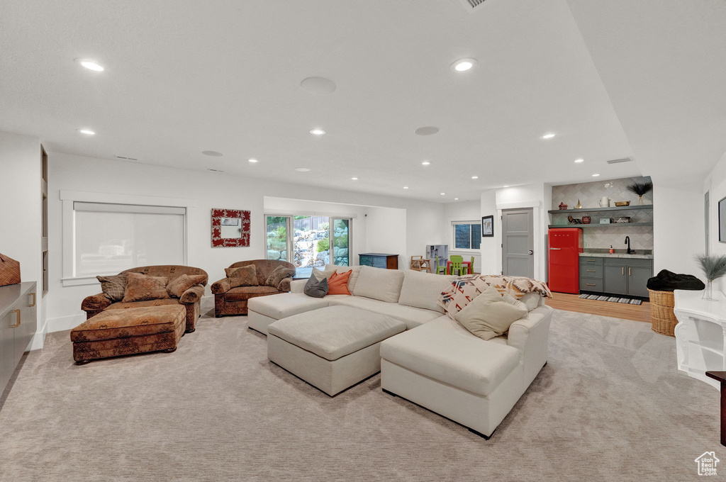 Living room with sink and carpet floors