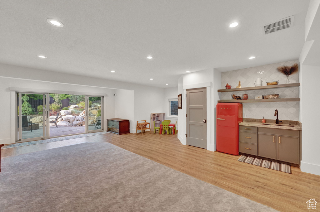 Interior space featuring sink and light hardwood / wood-style flooring