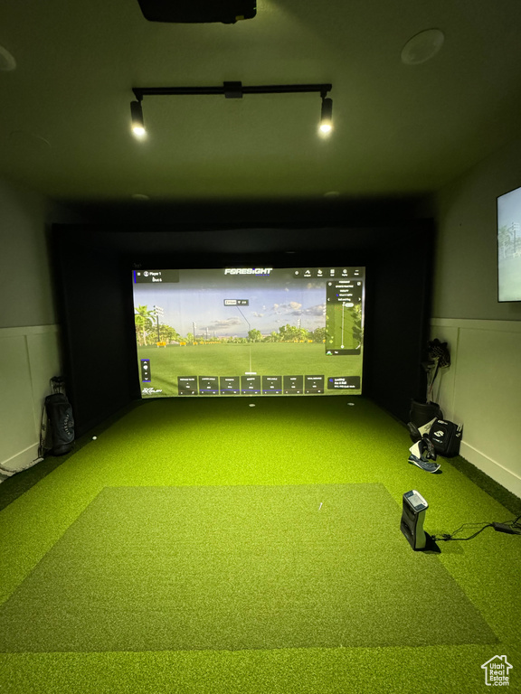 Recreation room featuring golf simulator and carpet floors