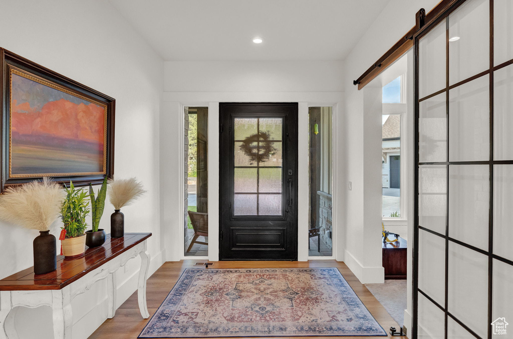 Entryway featuring a wealth of natural light and light hardwood / wood-style flooring