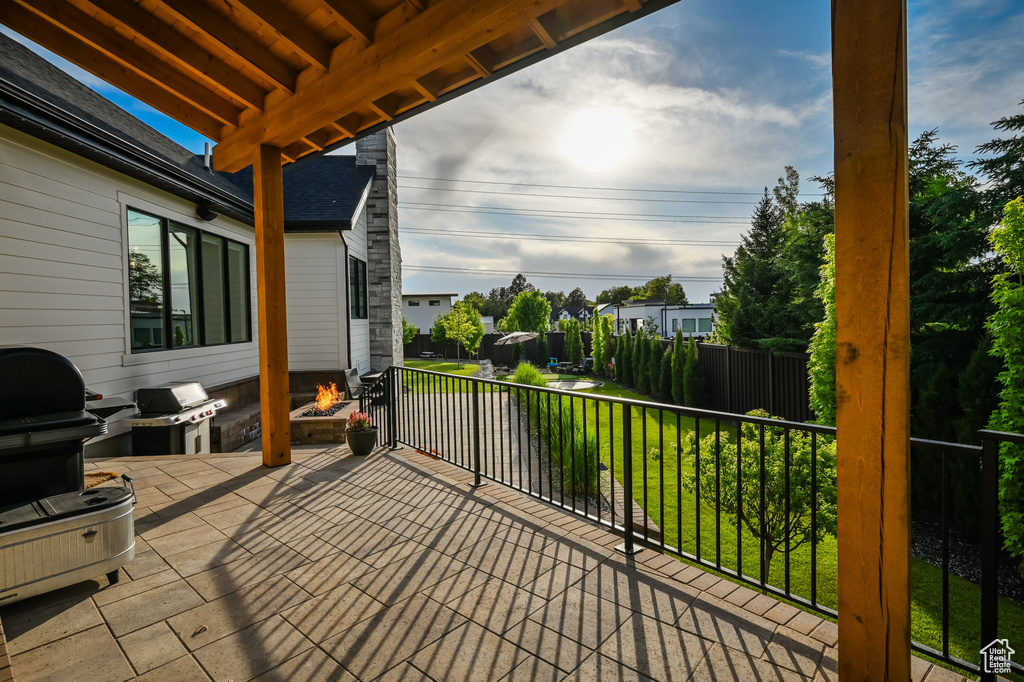 Exterior space with a balcony and area for grilling