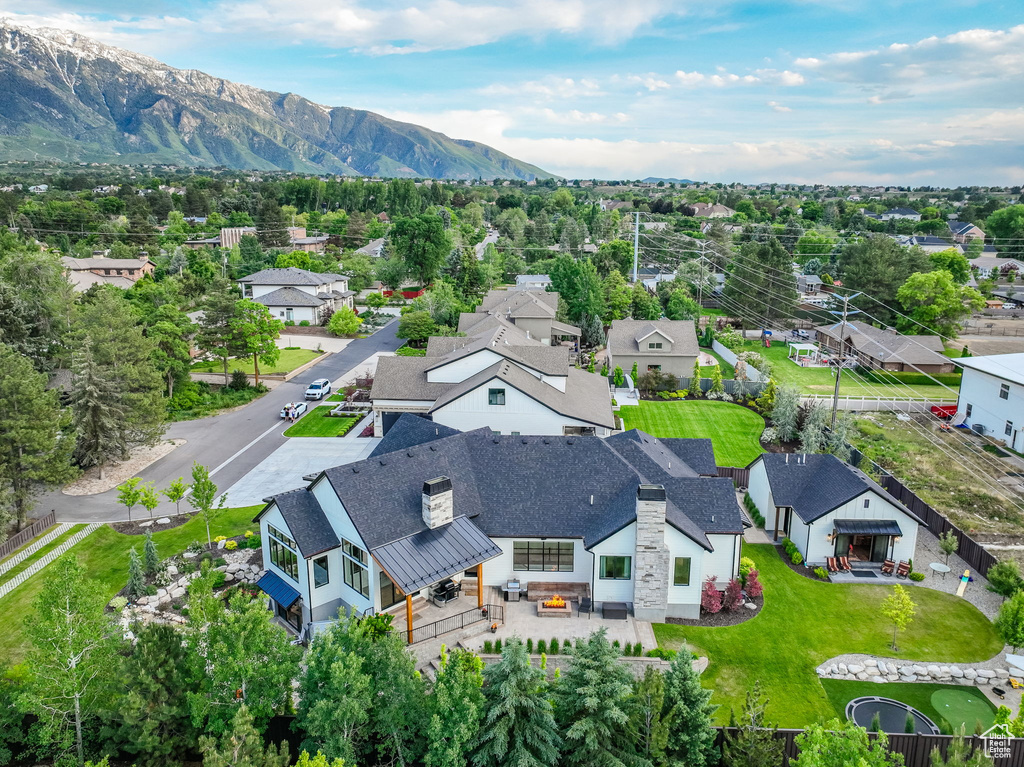 Birds eye view of property with a mountain view