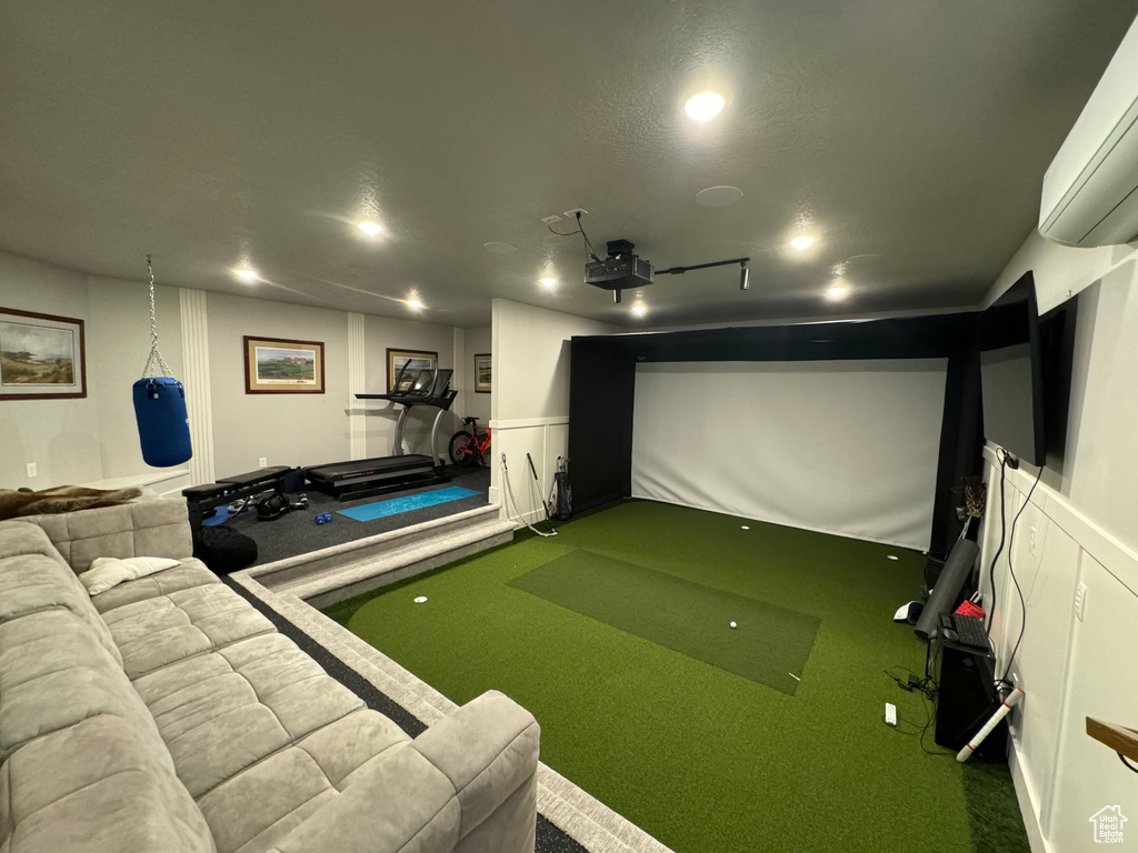 Home theater with golf simulator and carpet flooring