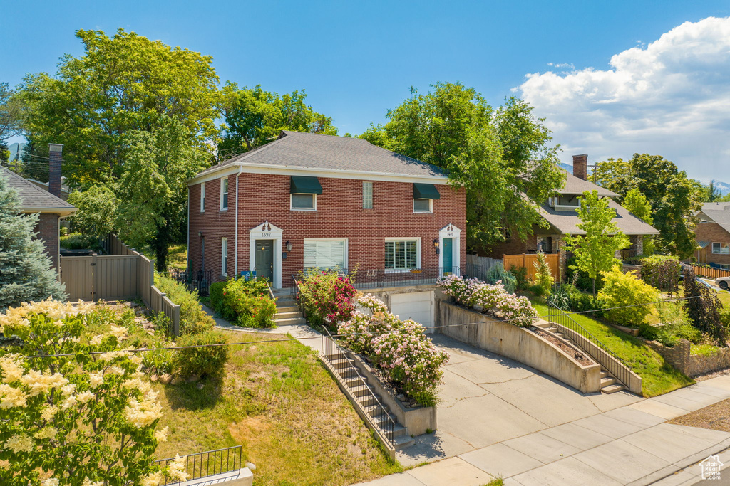 View of front of home featuring a garage