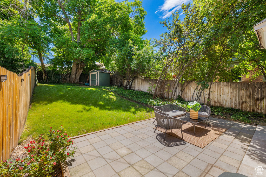 View of patio / terrace with a storage shed