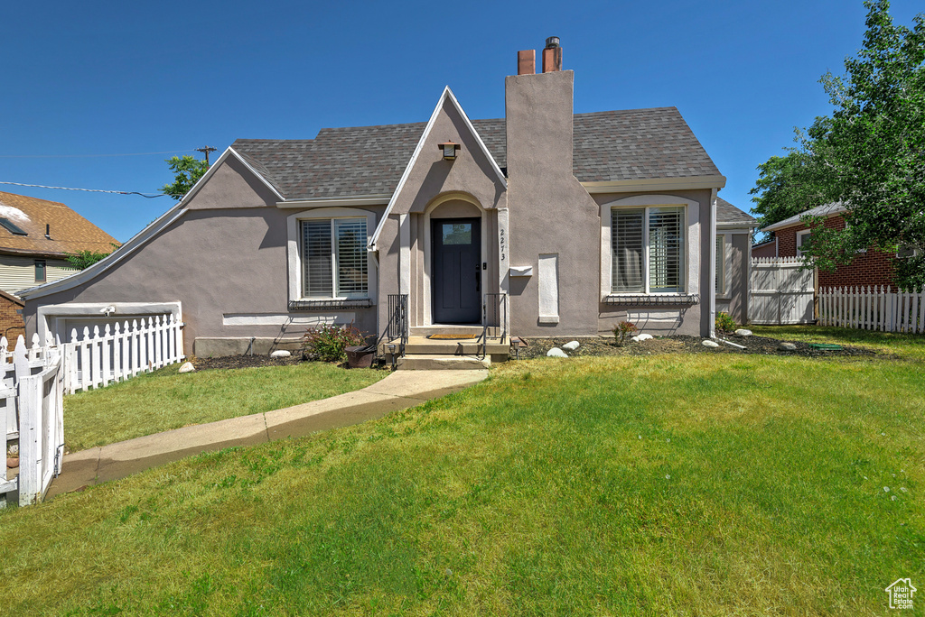 View of front of house with a front lawn