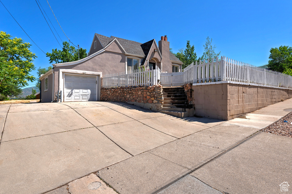 View of side of home featuring a garage