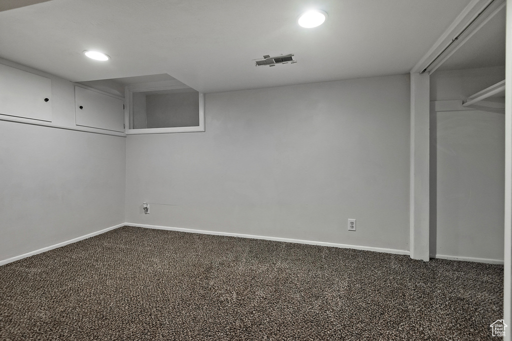 Basement featuring carpet flooring