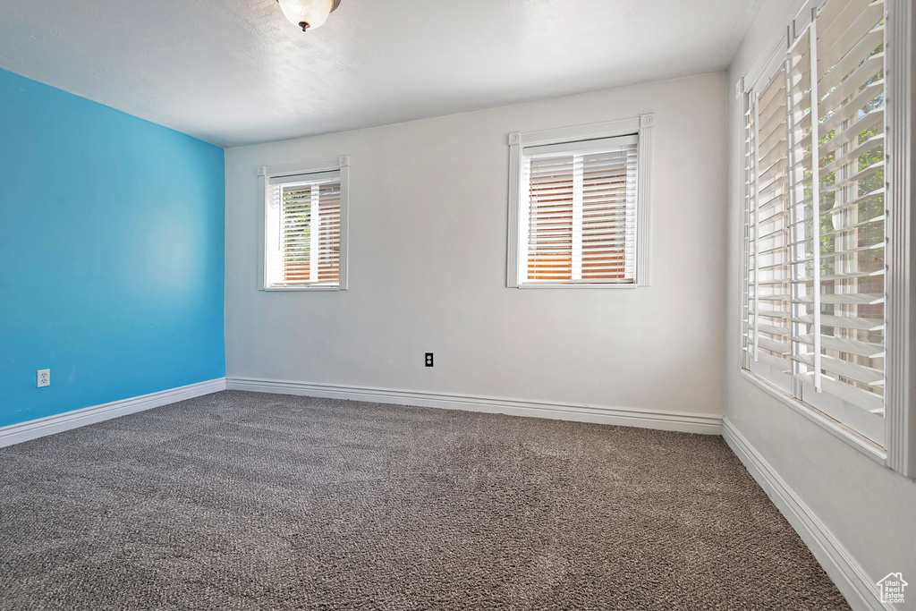 Empty room featuring carpet