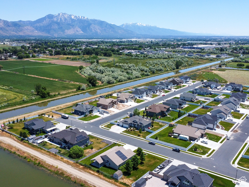 Aerial view featuring a water and mountain view