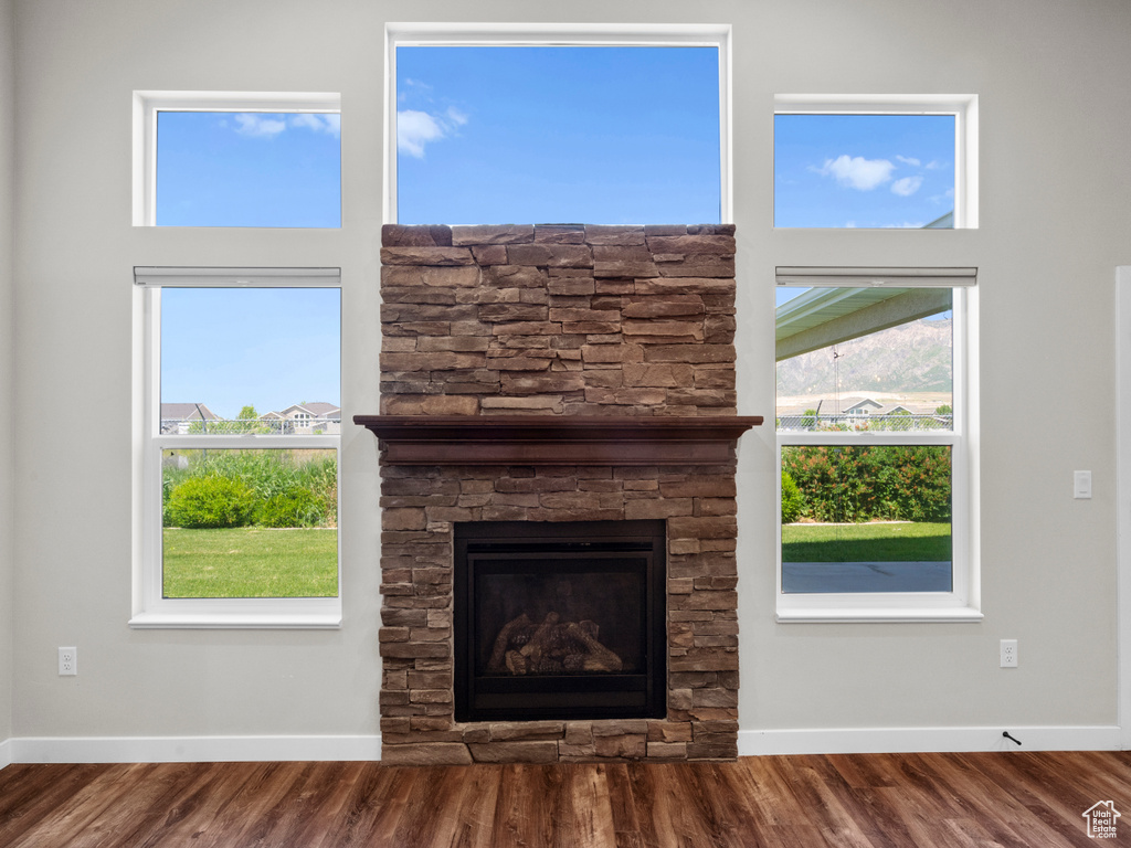 Interior details with hardwood / wood-style flooring and a fireplace