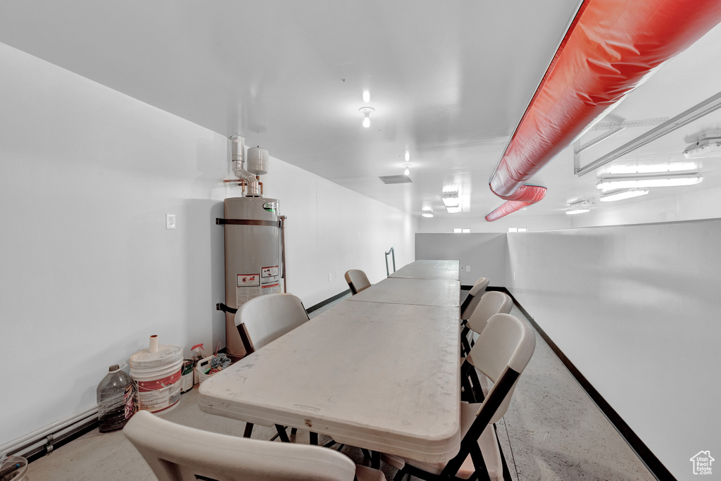 Dining space featuring secured water heater