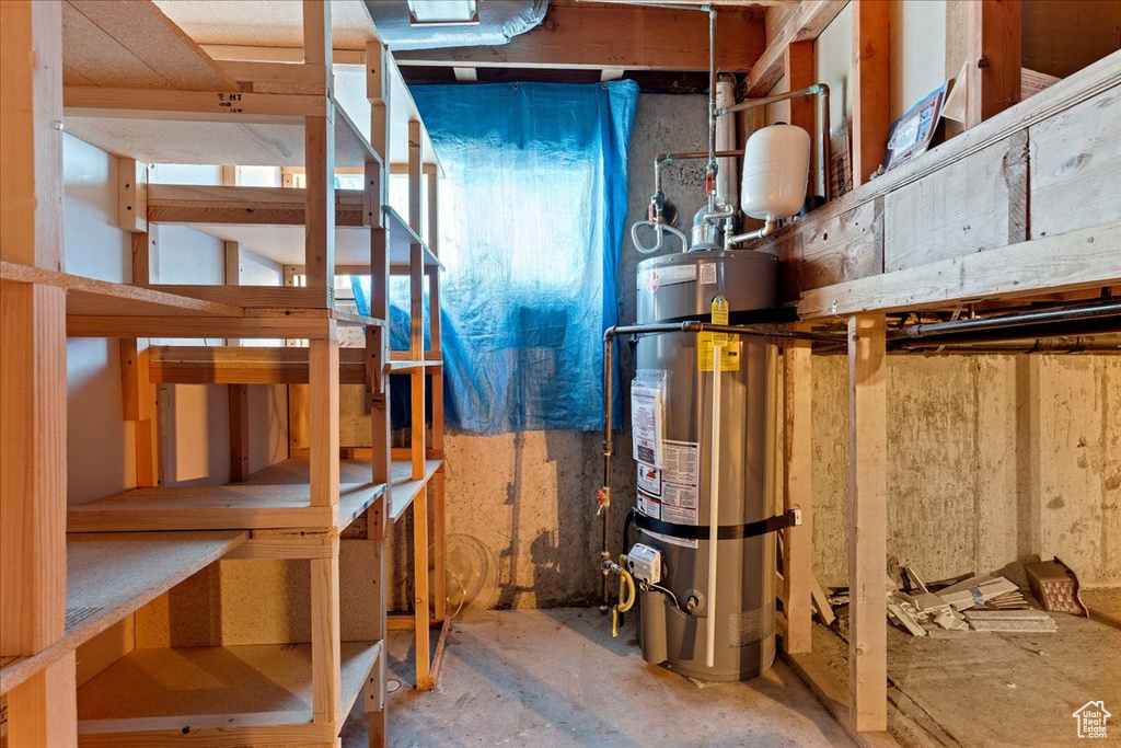 Storage area featuring water heater