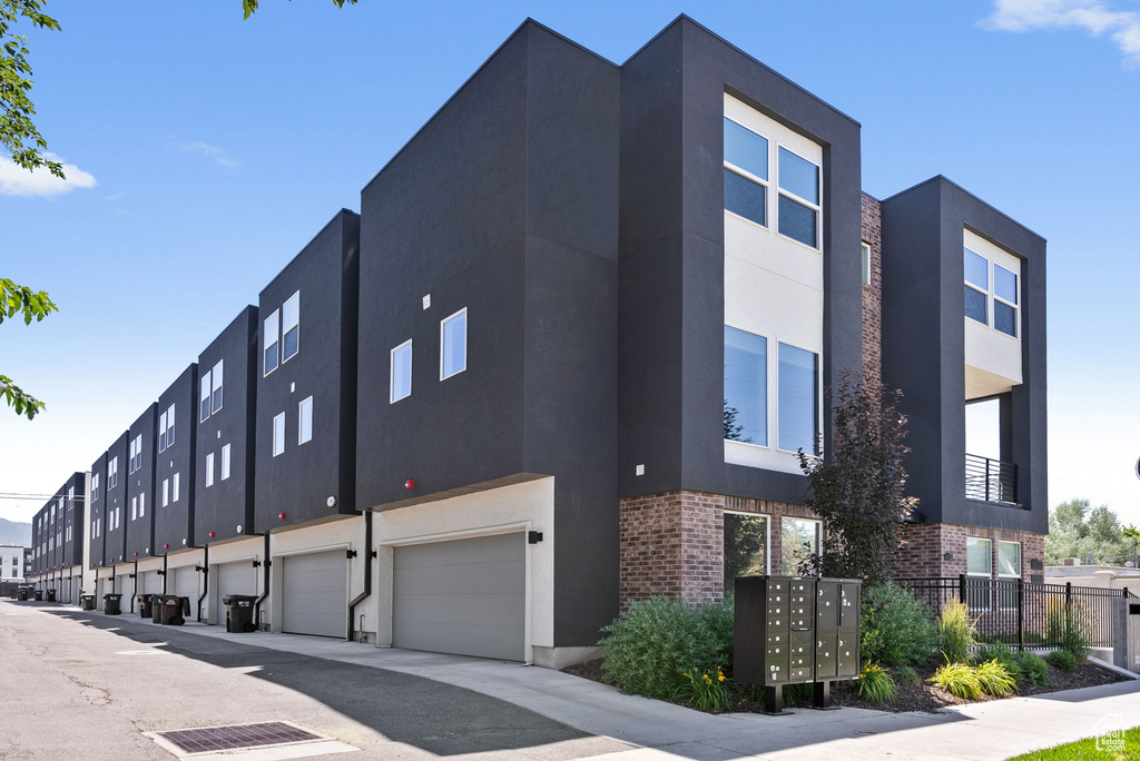 View of building exterior with a garage