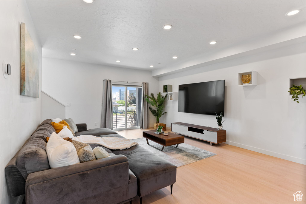 Living room with light wood-type flooring