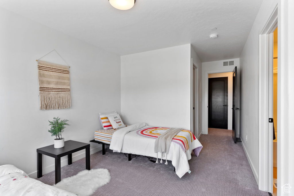 Bedroom featuring carpet floors